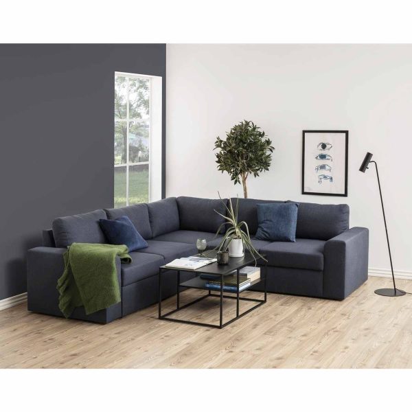 Mesa Centro Nivelax ambientada en un living con sofá seccional gris