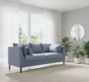 sofá gris en un living con espejo redondo